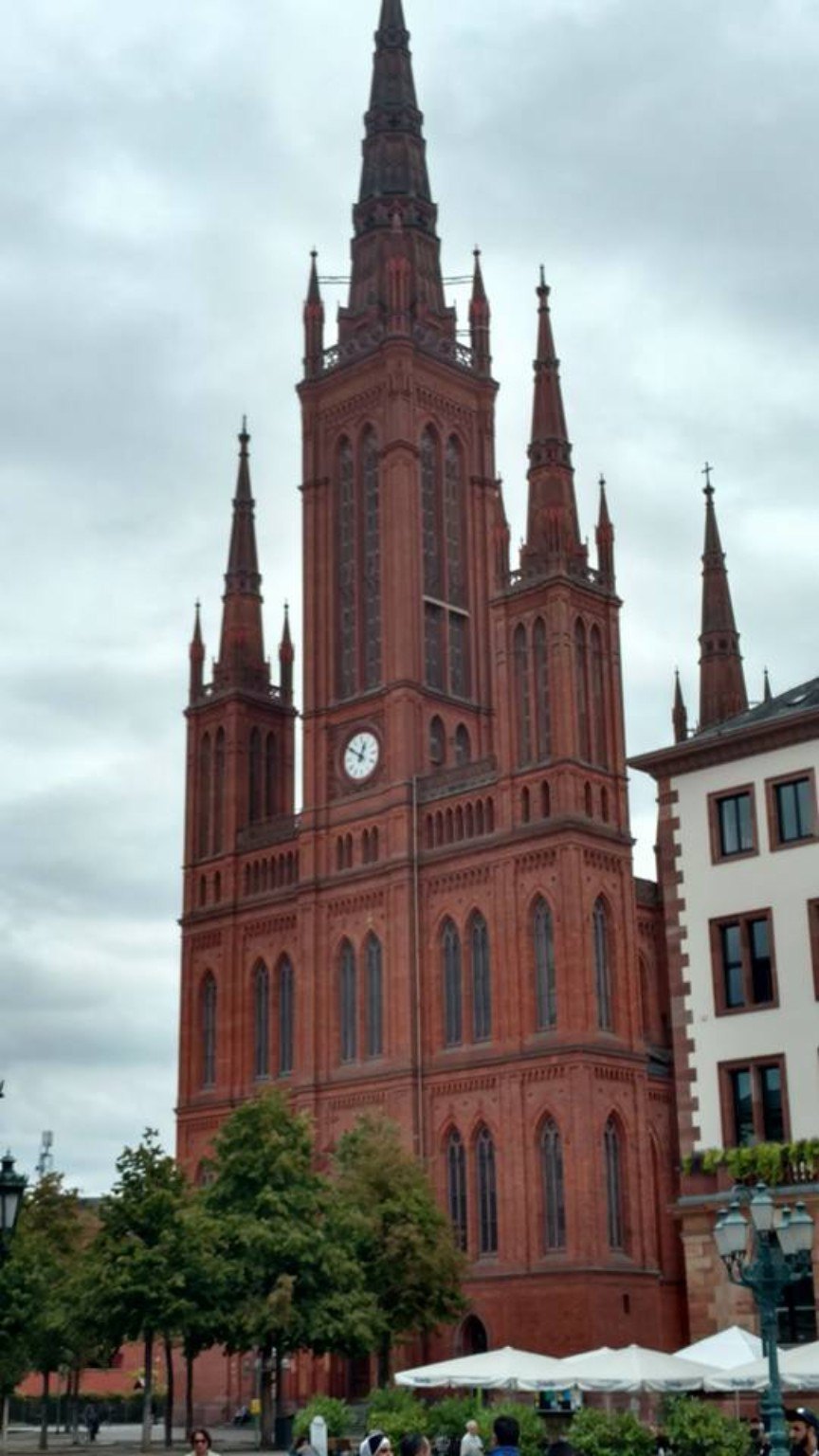 The red-brick spires of Wiesbaden's Marktkirche rising above the square