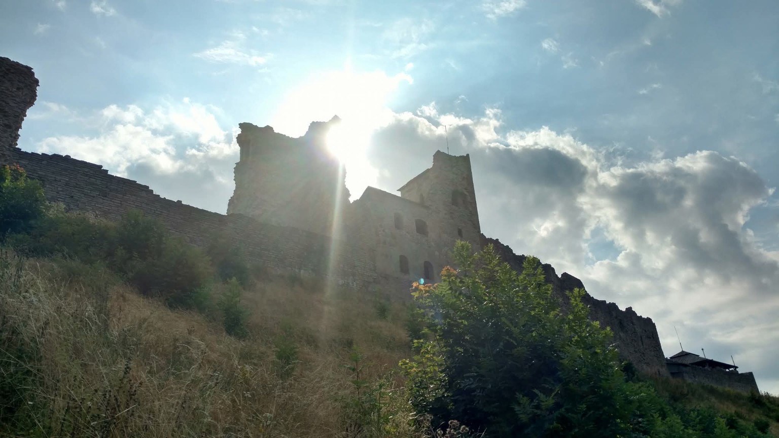 Rakvere Castle ruins silhouetted against the late-day sun