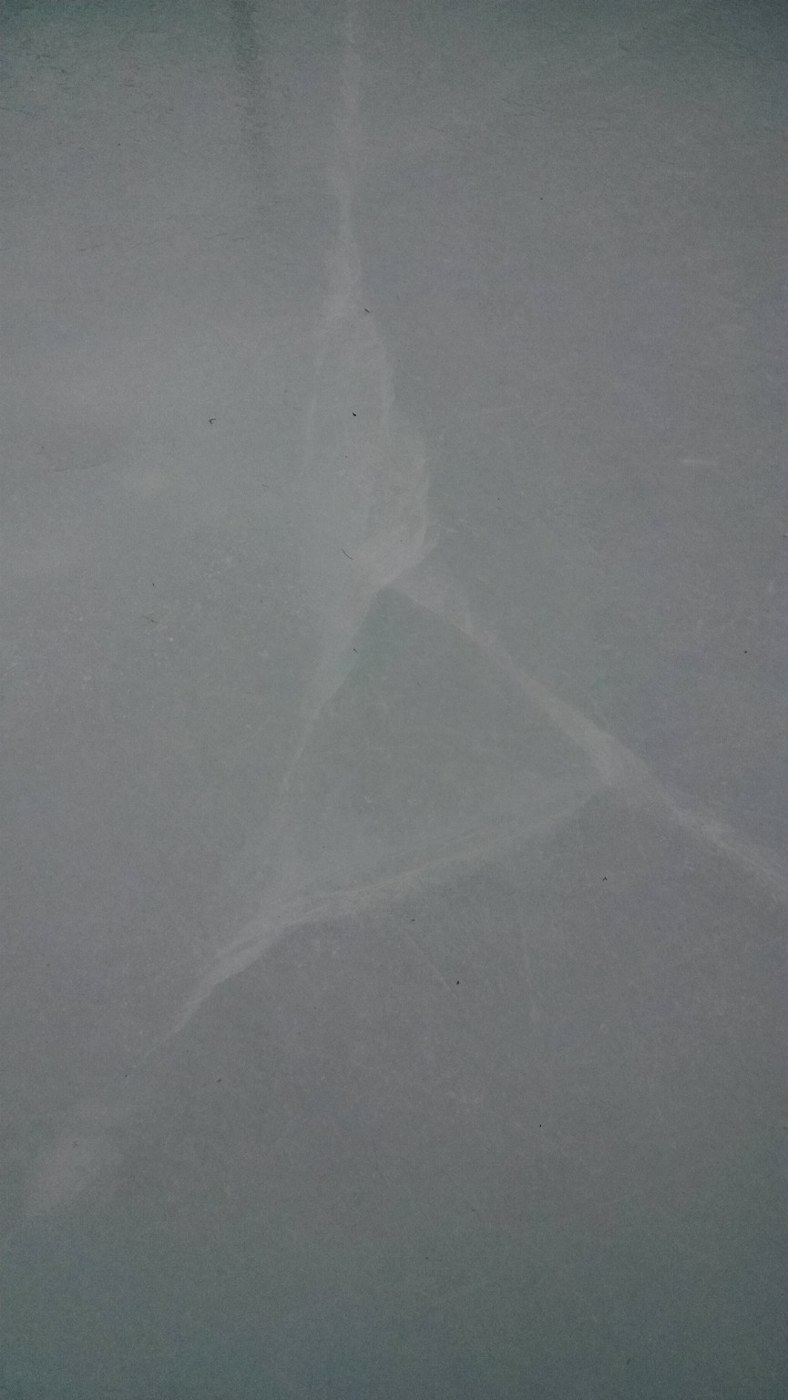Cracked ice surface on the backyard rink