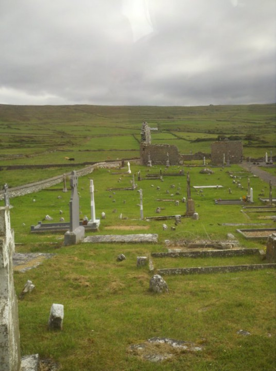 Old stone church ruins and graveyard in the Irish countryside