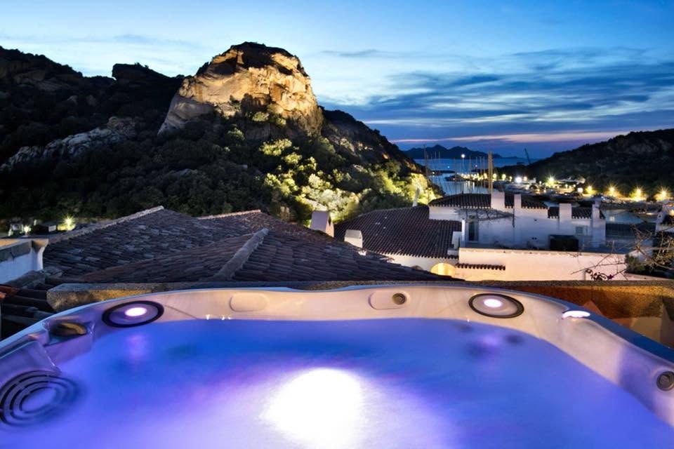 Evening over a Sardinian marina from a hot tub