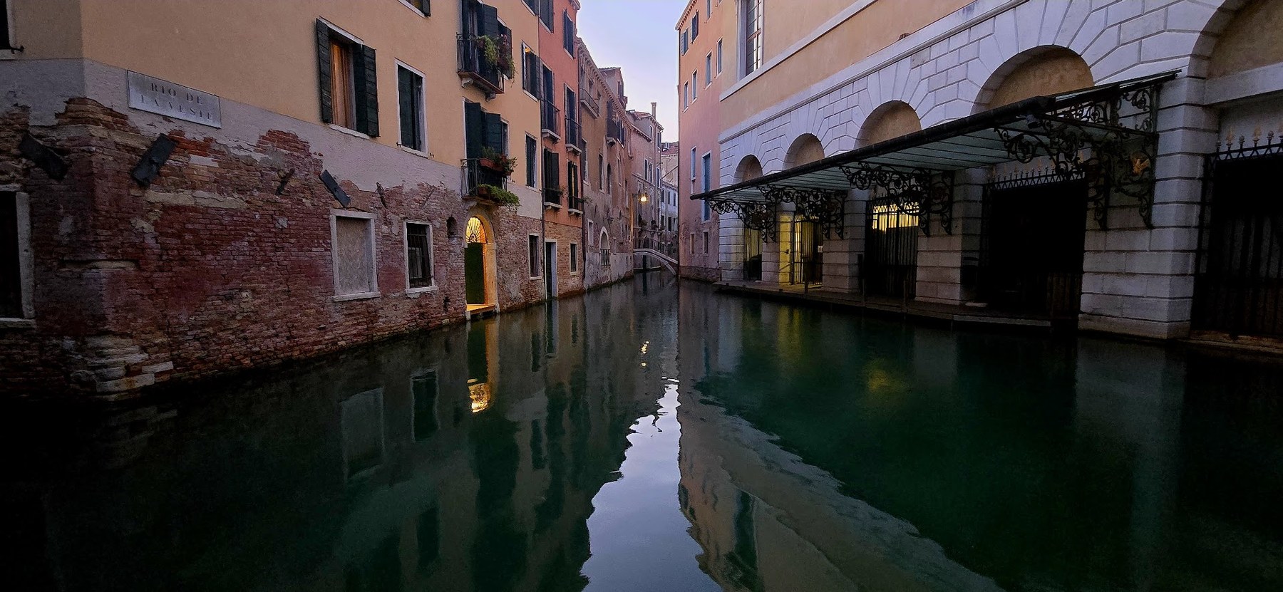Quiet Venetian canal at dusk