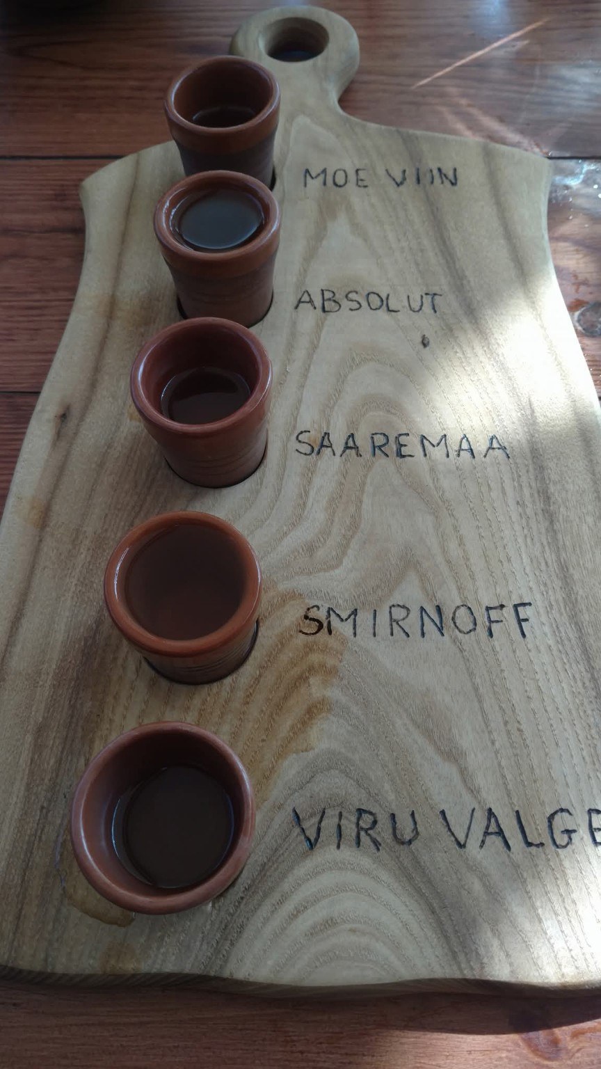 Local Estonian spirits tasting board with Moe Viin, Saaremaa, Smirnoff, and Viru Valge