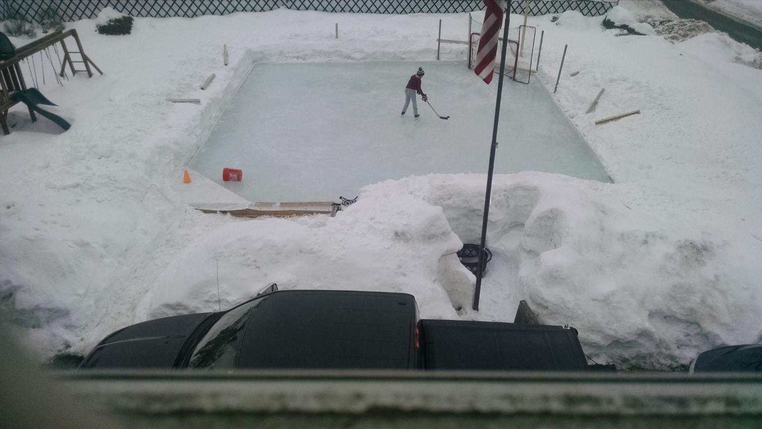Overhead view of snow covering the backyard rink