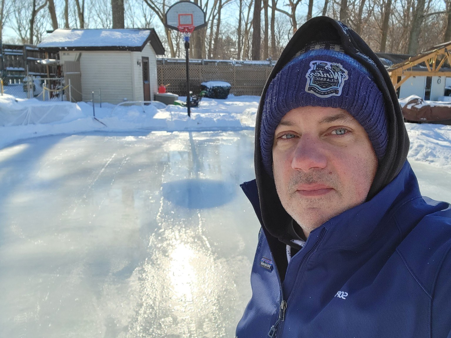 Selfie on a bright winter day at the backyard rink