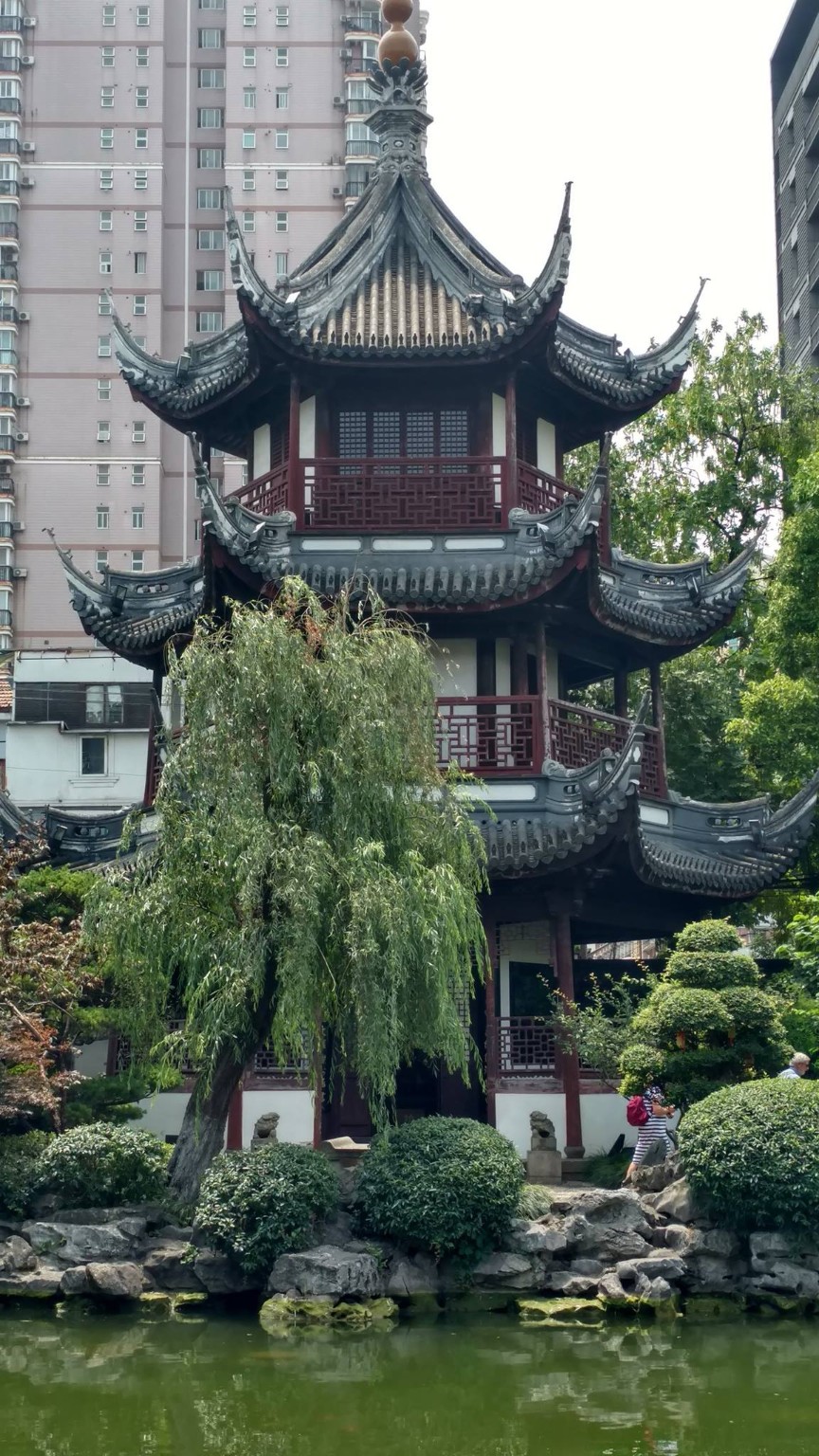 Traditional pavilion architecture reflected in the garden pond