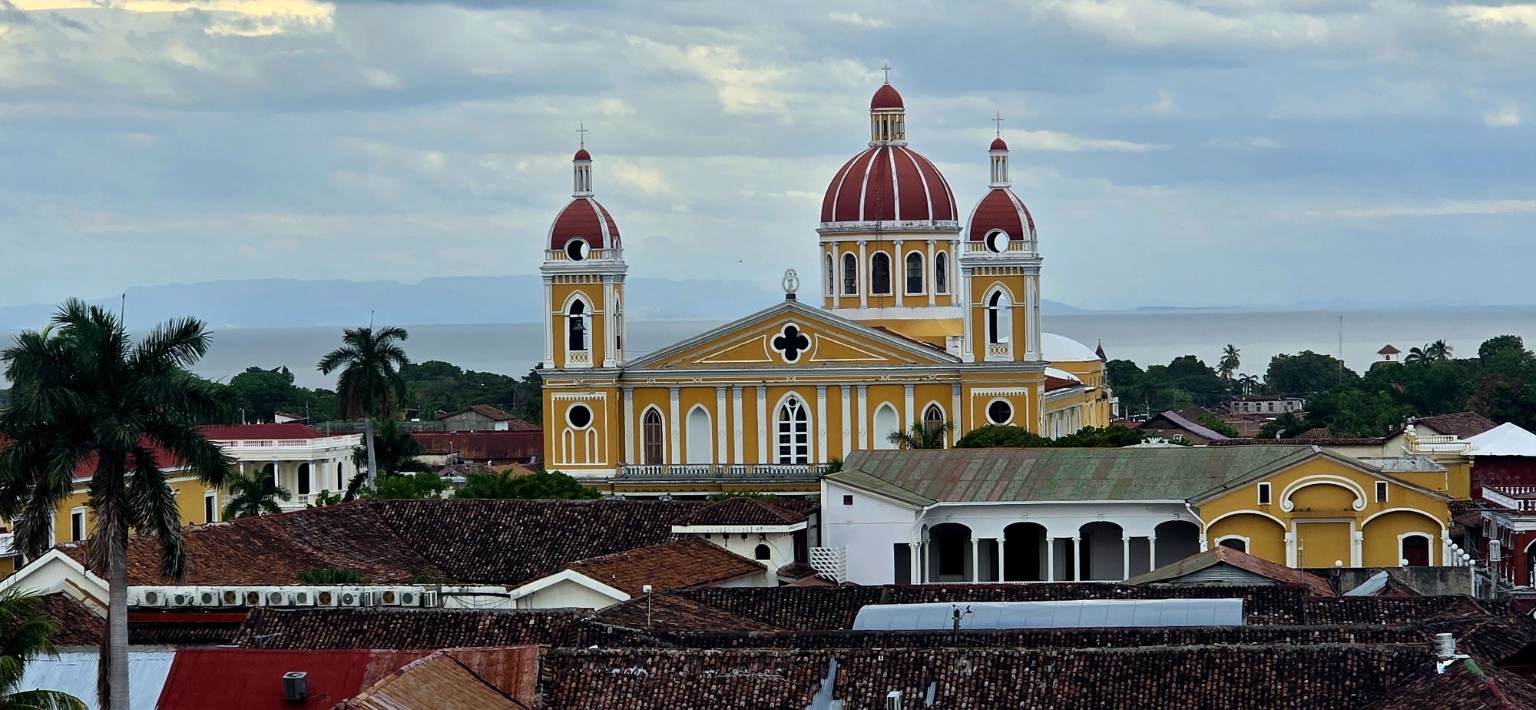 Granada cathedral above the red rooftops