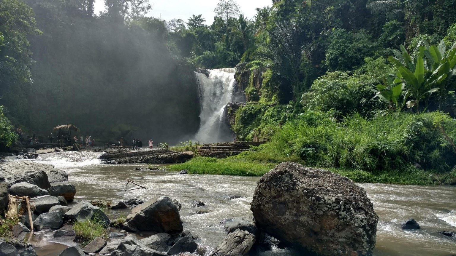 A lush waterfall stop on the island tour