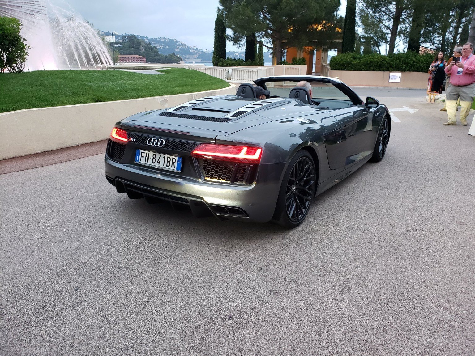 An Audi R8 convertible parked on a Monaco street
