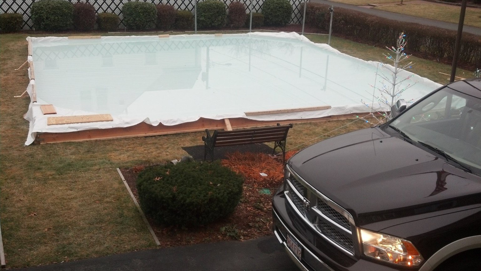 Water filling a backyard rink liner for the first time