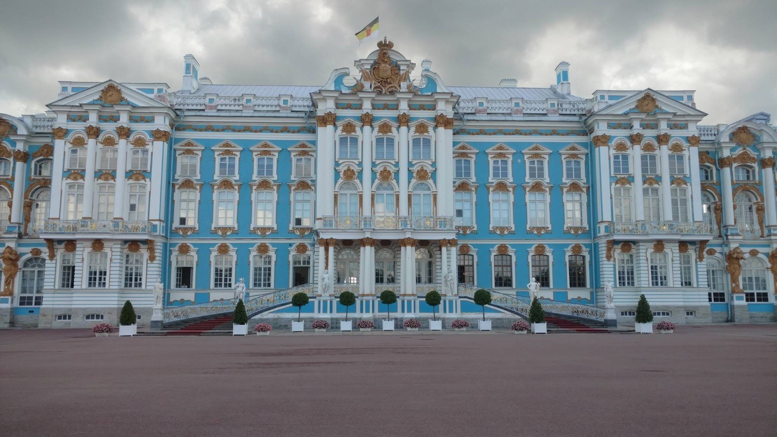 Blue and white facade of Catherine Palace trimmed in gold