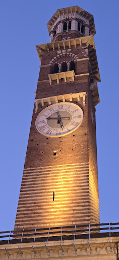 Torre dei Lamberti clock tower at night