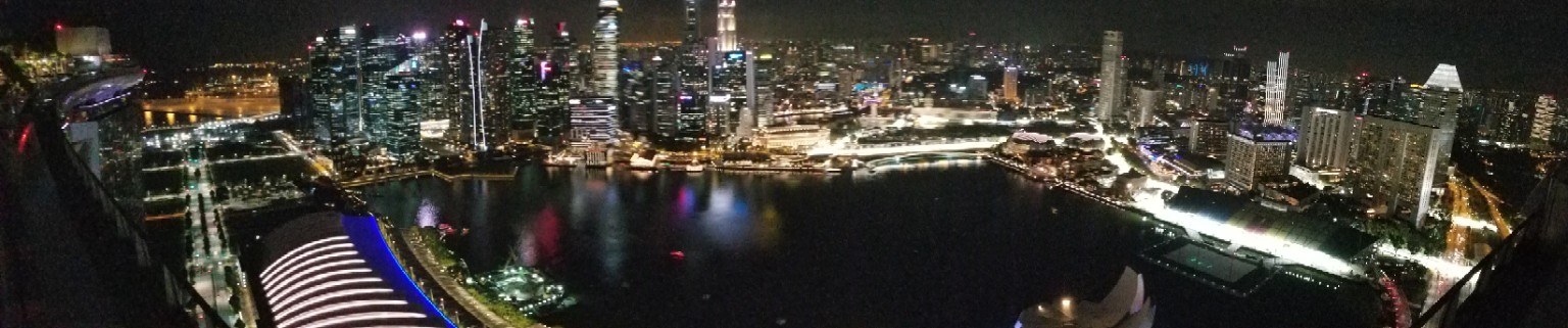 Ultrawide night view of the Singapore skyline across Marina Bay