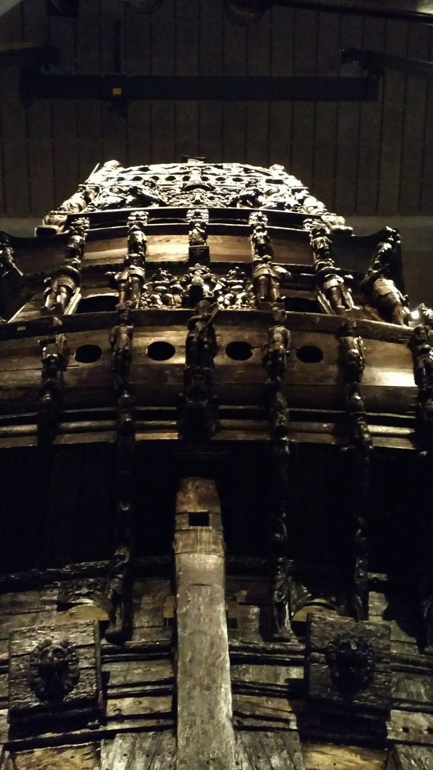 Vasa bow rising in the dark museum hall
