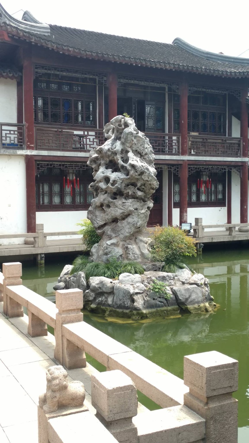 A scholar rock in a classical garden setting