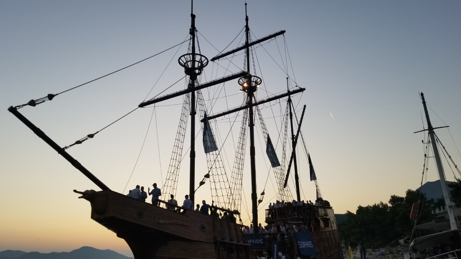 Wooden ship at sunset during a Sophos conference event on the Adriatic