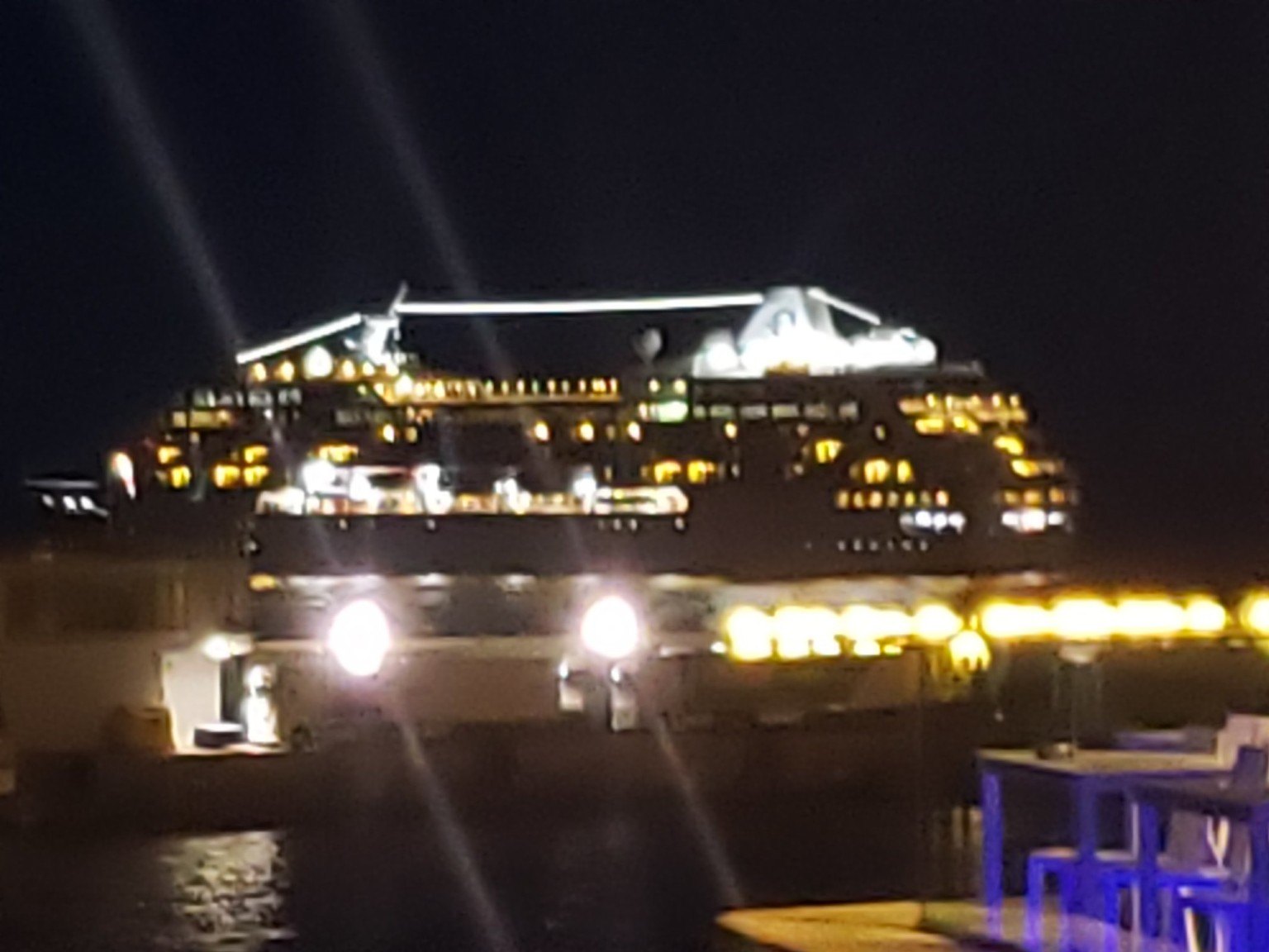Lit yachts in Monaco harbor at night