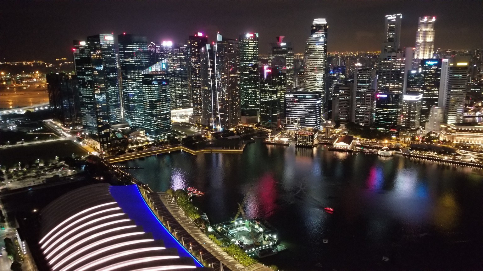 Marina Bay Sands and the Singapore skyline reflected on the water at night