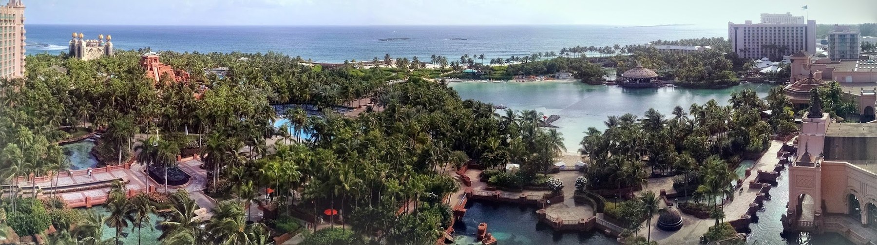 Atlantis from above, a full sweep of Paradise Island, lagoons, palms and blue Atlantic beyond.