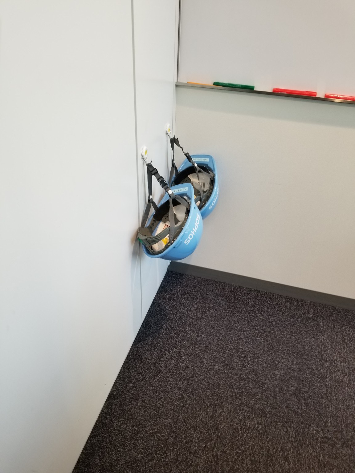 Hard hats hanging in a Tokyo conference room