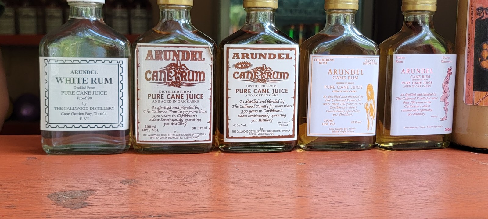 Arundel rum bottles at Callwood Distillery, including a few cheeky labels.
