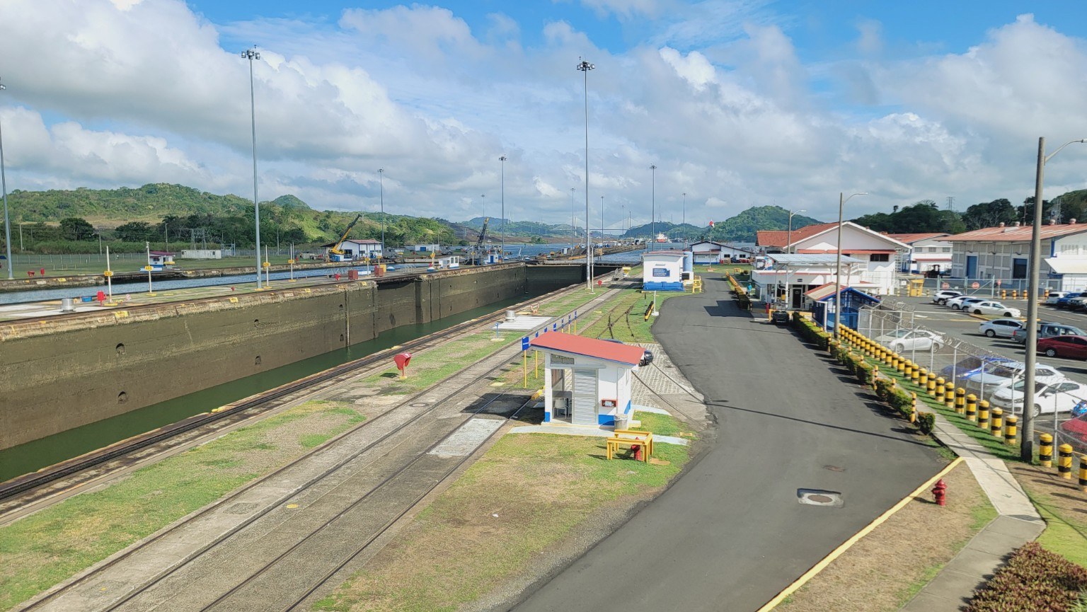 Empty Miraflores lock chambers between transits, with green hills in the distance