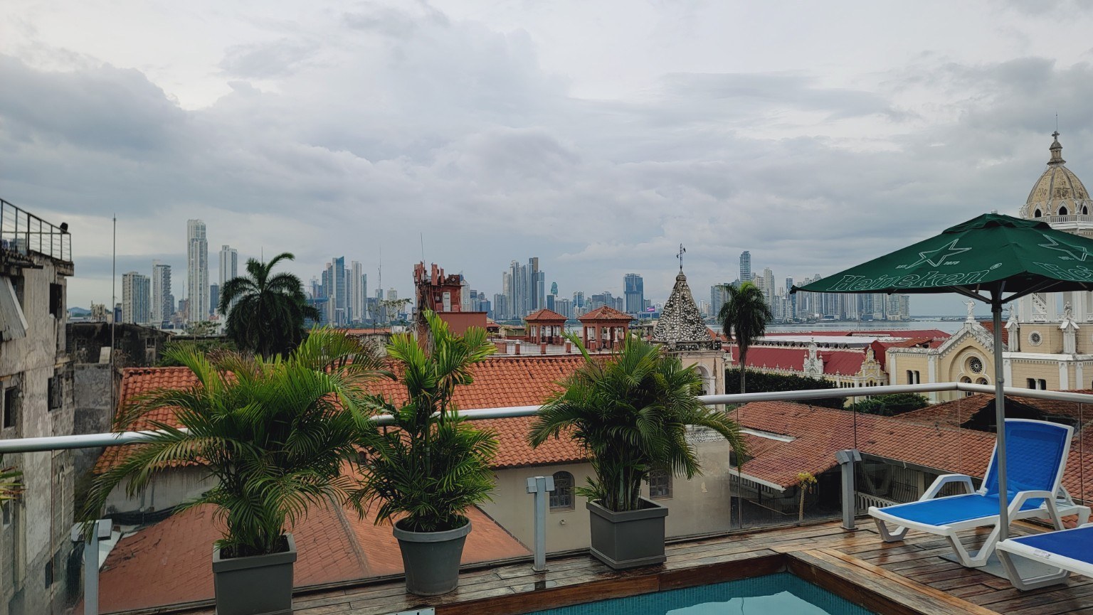 Red-tiled Casco Viejo rooftops with the modern Panama City skyline behind