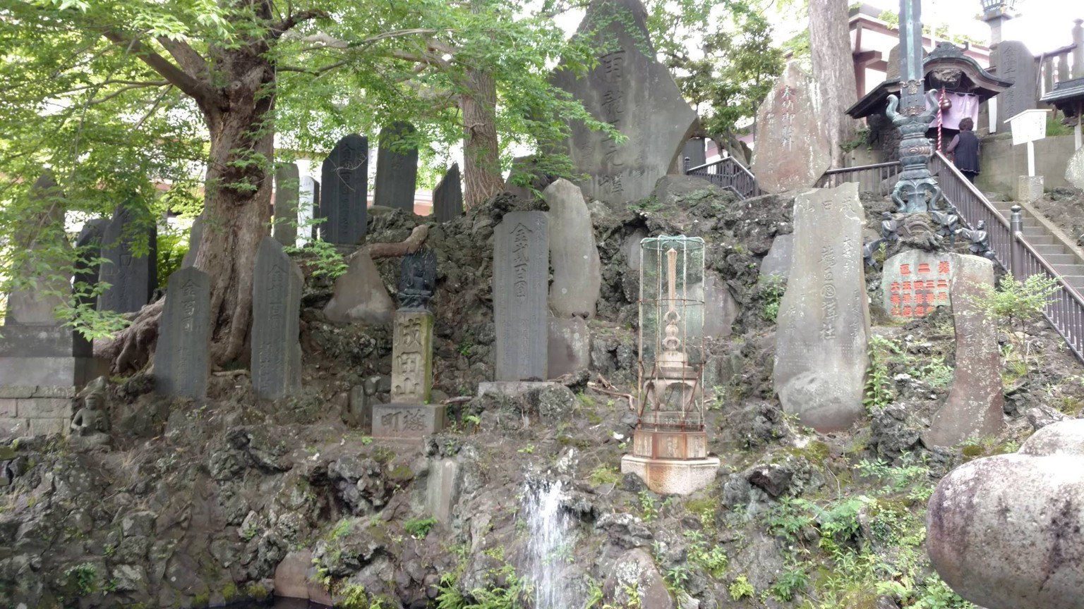 A small bridge and stonework within the temple grounds