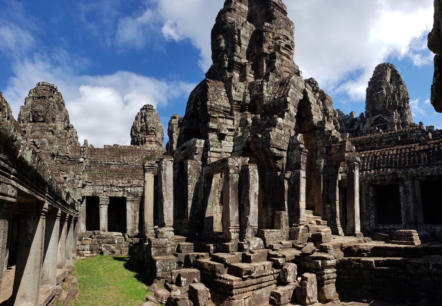The layered towers and galleries of Bayon, dappled in late-morning sun
