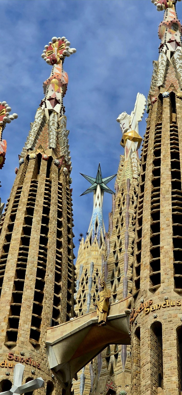 Detail of Sagrada Família tower pinnacles with star and mosaic