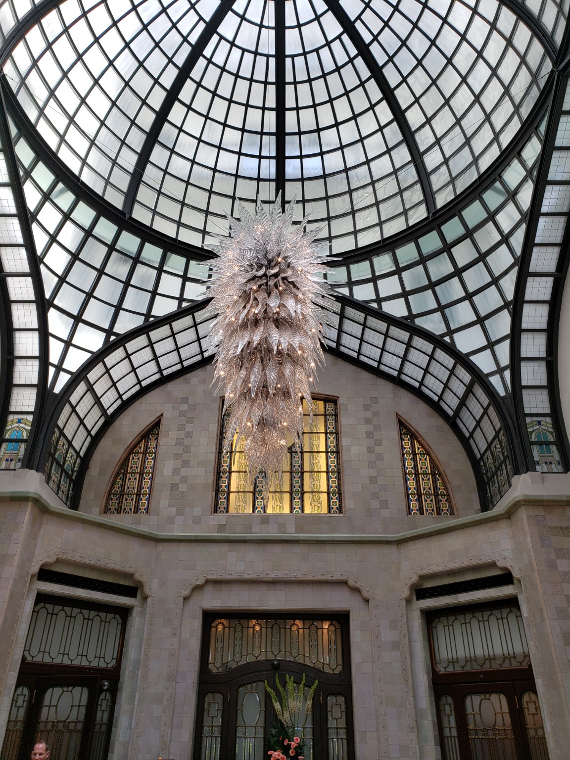 A dramatic glass ceiling and chandelier in Budapest