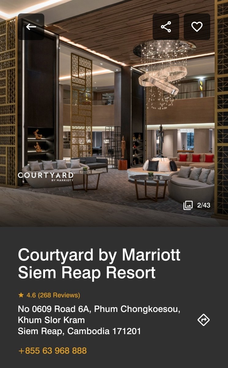 The pool and palm-lined courtyard of the Courtyard by Marriott Siem Reap Resort