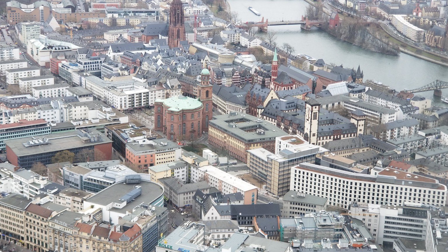 Frankfurt from above, with the medieval core, river, and finance skyline overlapping