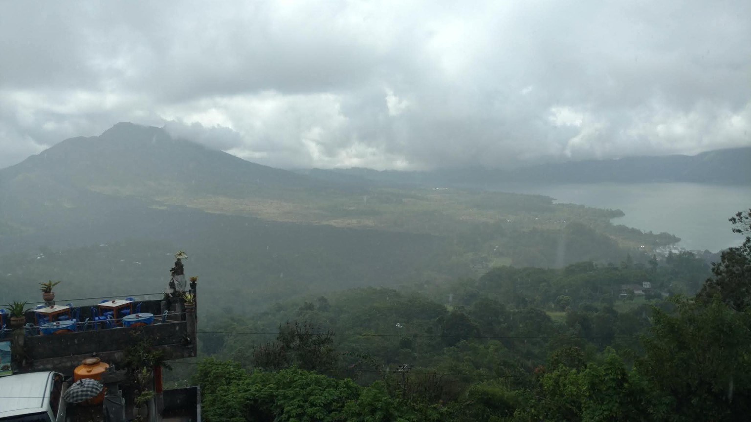 Misty views over Bali, with clouds, mountains, and water blending together