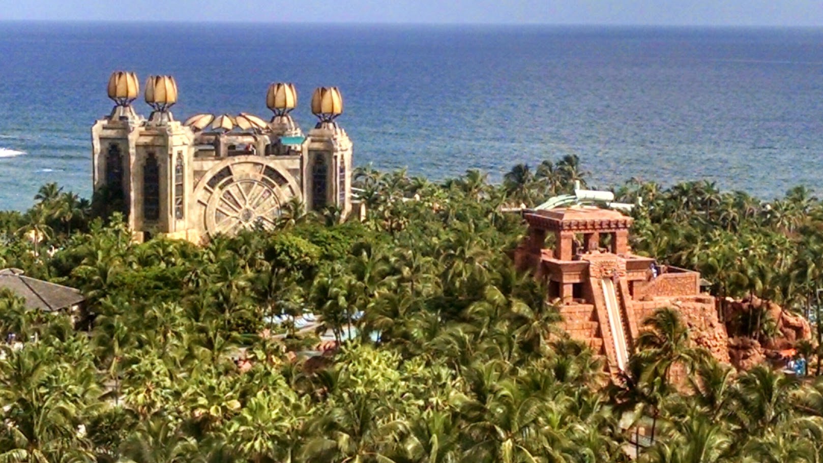 Aquaventure below the tower, a Mayan-inspired waterslide complex wrapped in palm trees.
