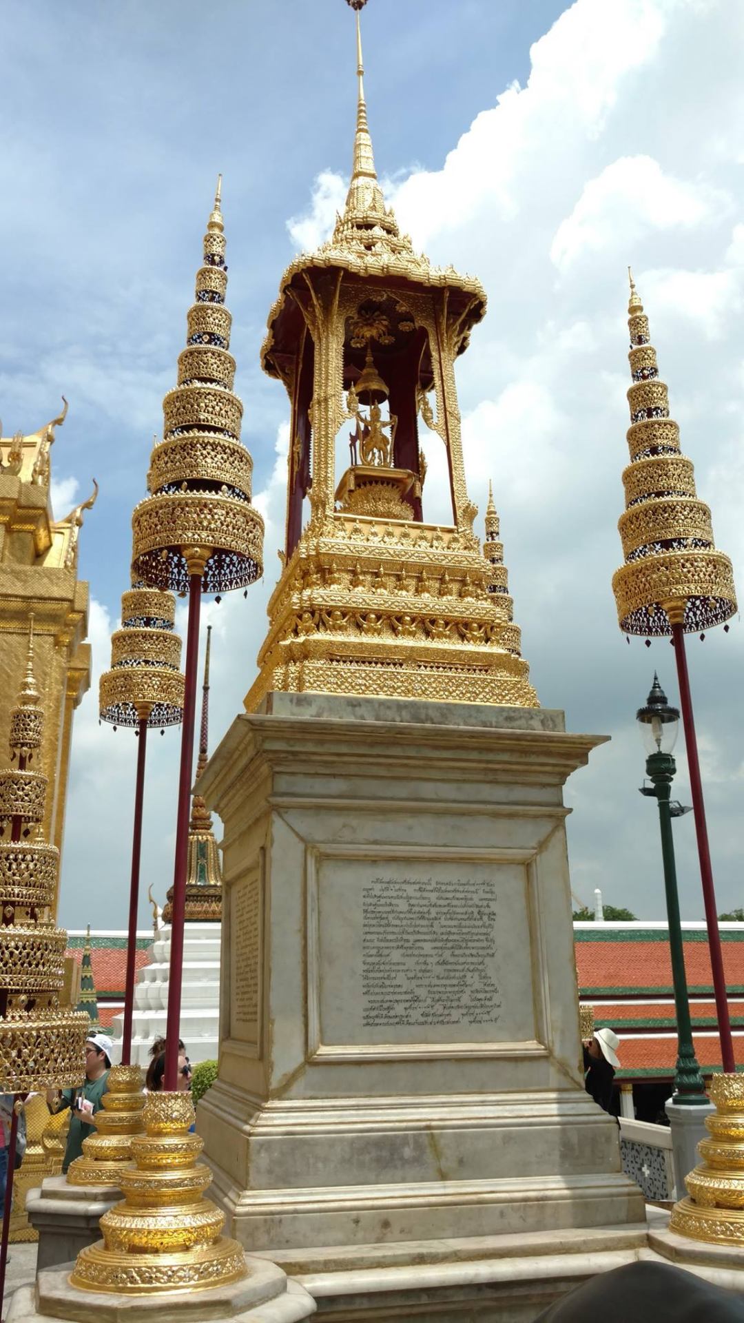 Marble pedestal with a small gold pavilion and ornate spires at the Grand Palace