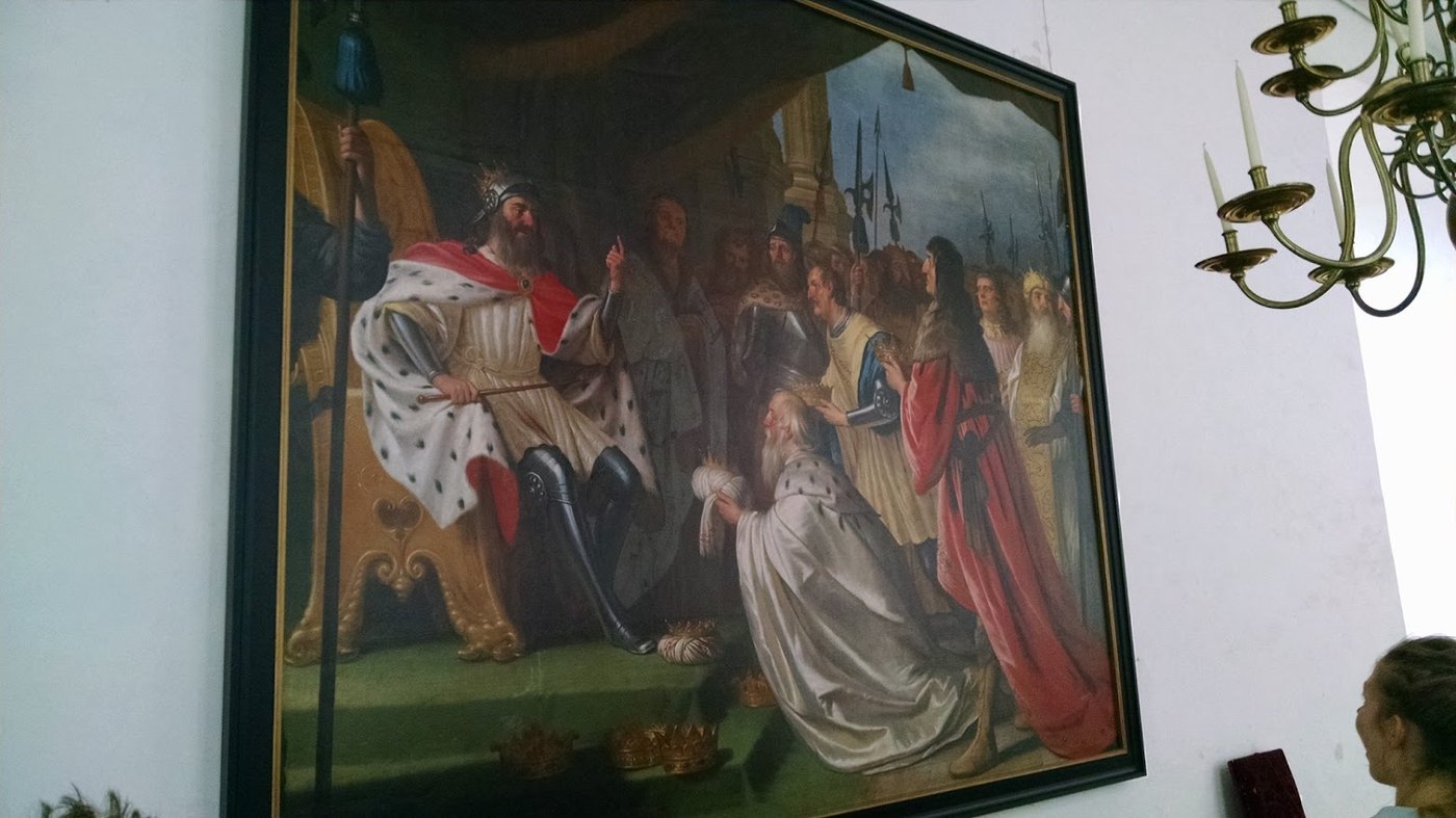 Another Kronborg painting, full of ceremony, hierarchy and very serious hats