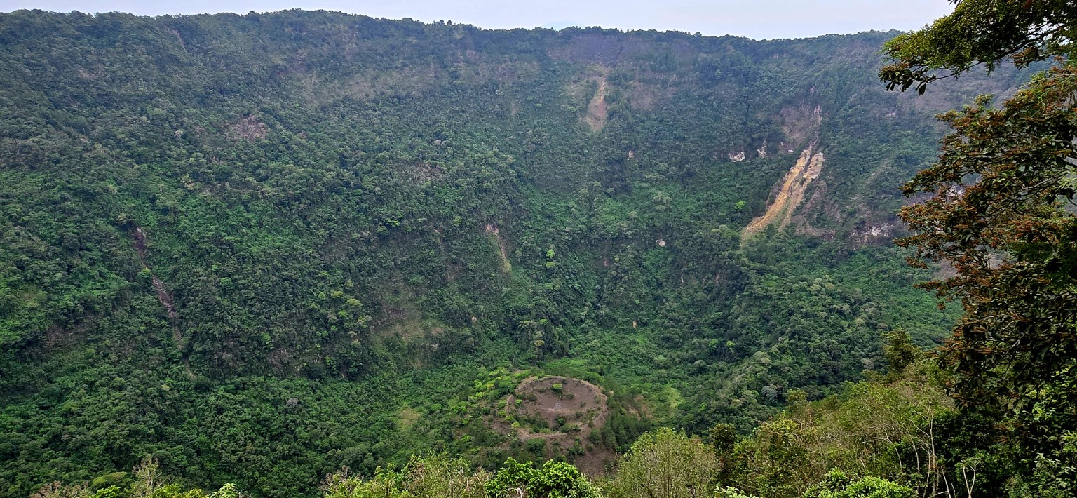 Aerial view of El Boquerón crater in El Salvador with the smaller Boqueroncito cone