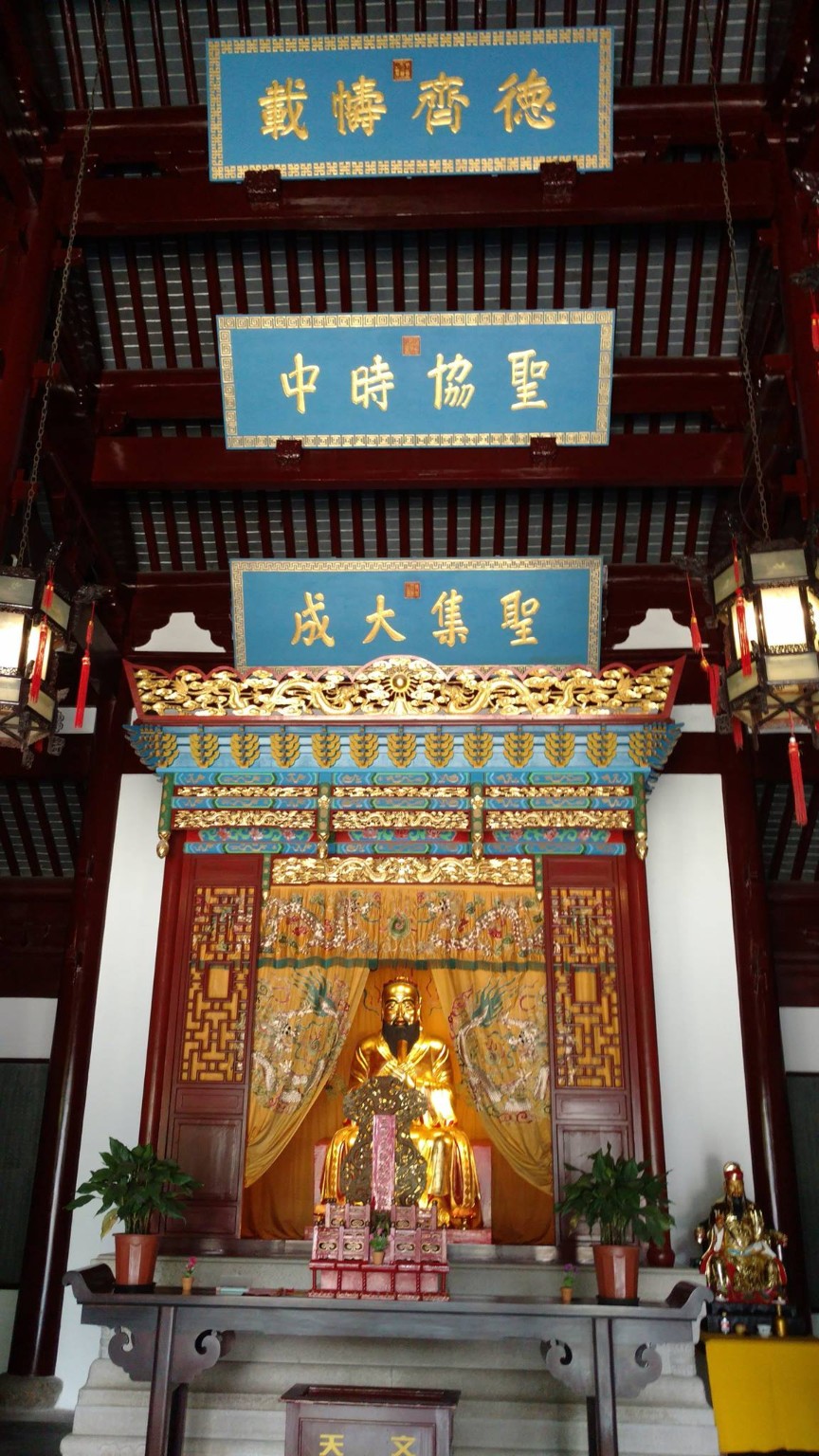 Interior Confucius hall with statue, plaques, and ceremonial details