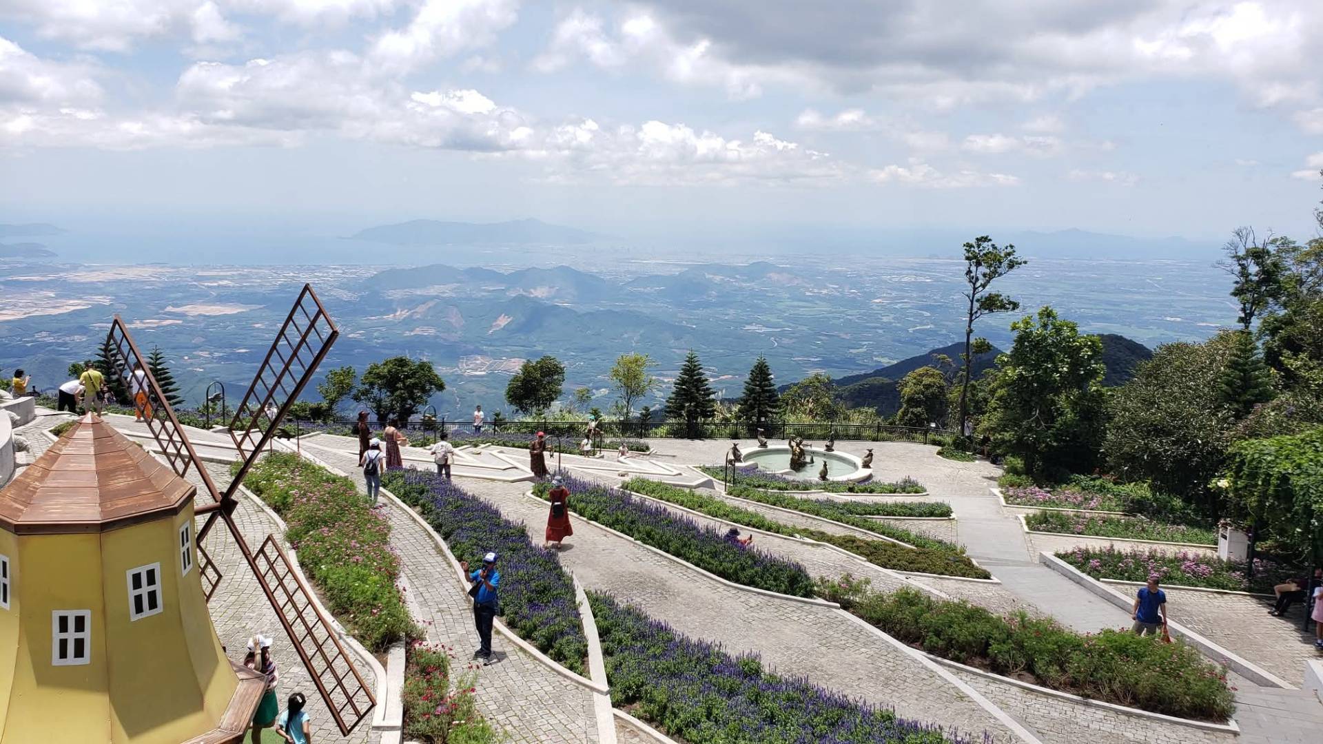 Windmill and lavender beds at Ba Na Hills overlooking distant mountains