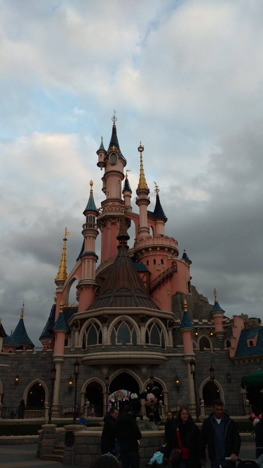 Disneyland Paris castle under a moody sky