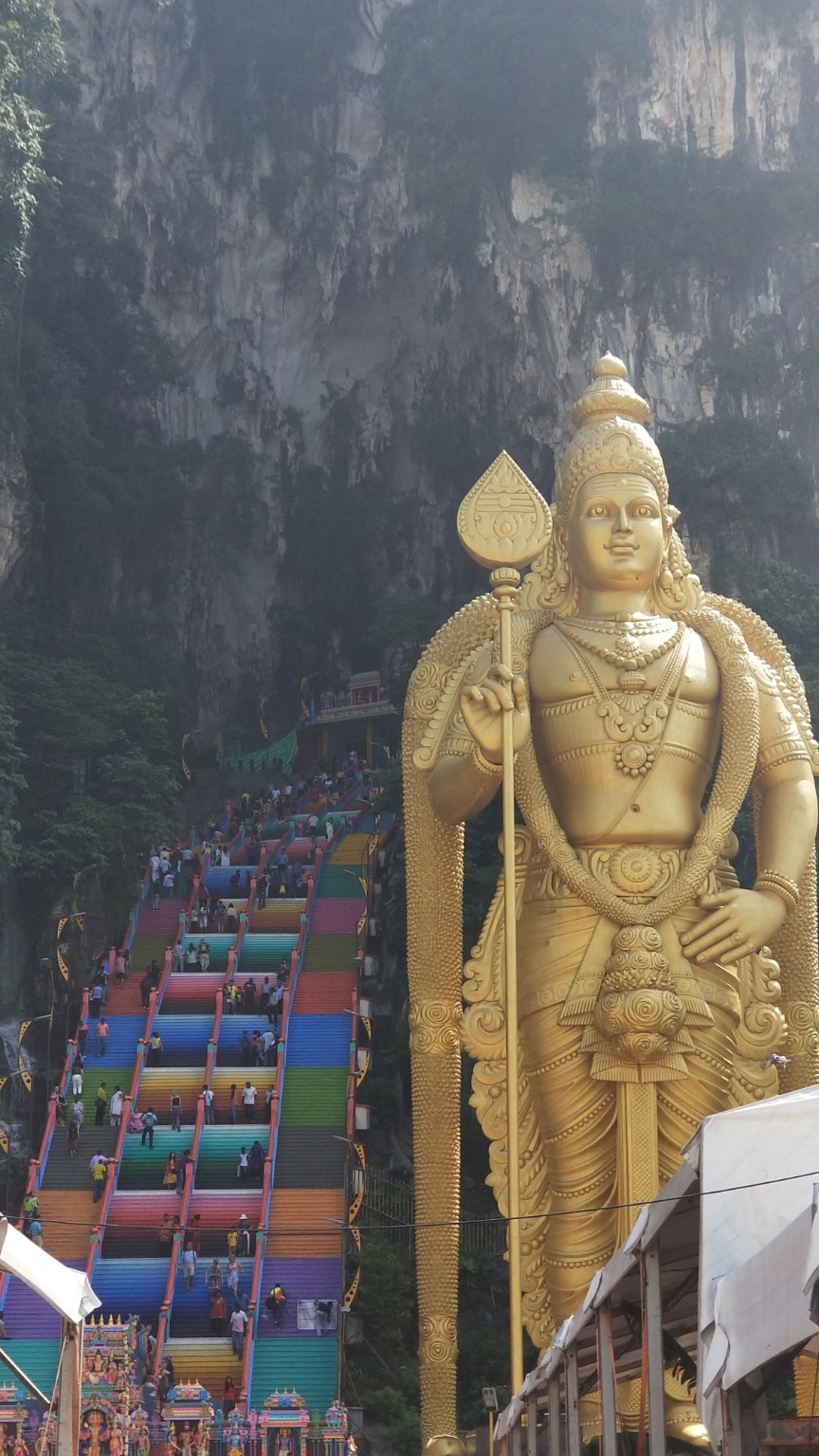 Lord Murugan statue and colorful Batu Caves steps