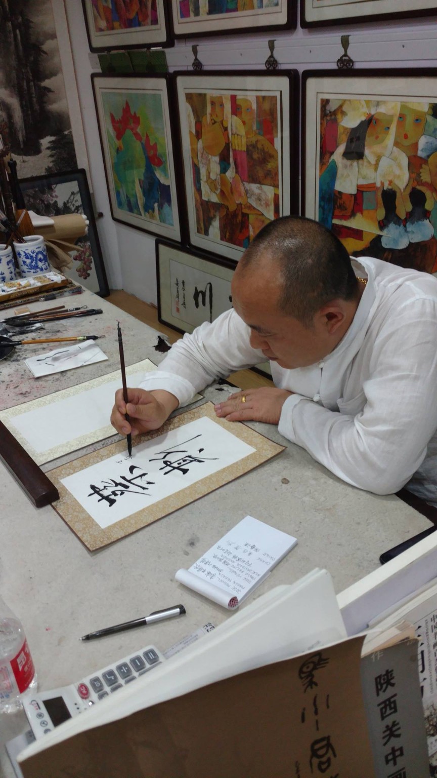 A calligraphy artist at work