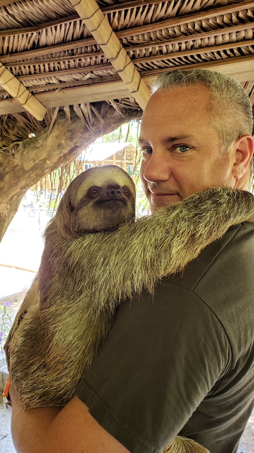 Holding a sloth in Roatán