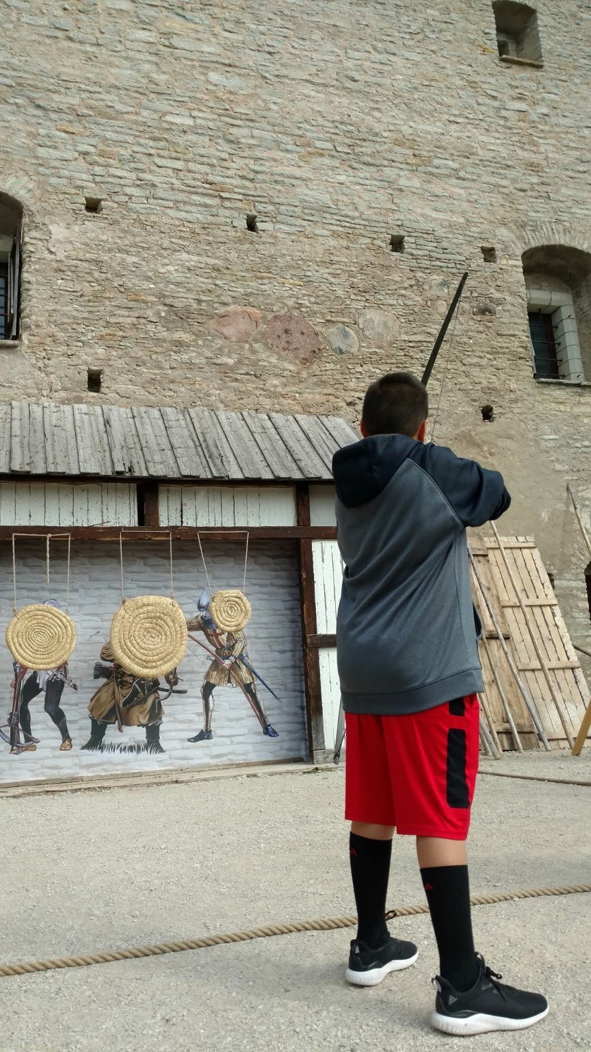 Chase taking aim with a bow at Rakvere Castle